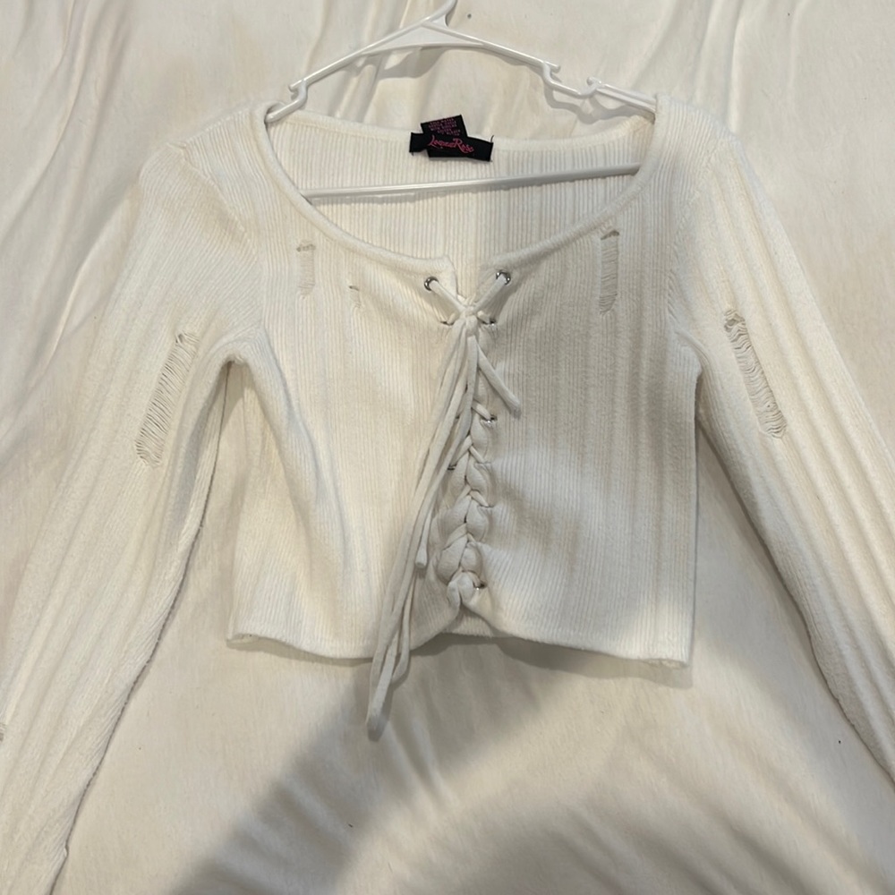 white long sleeve with rips and tied up